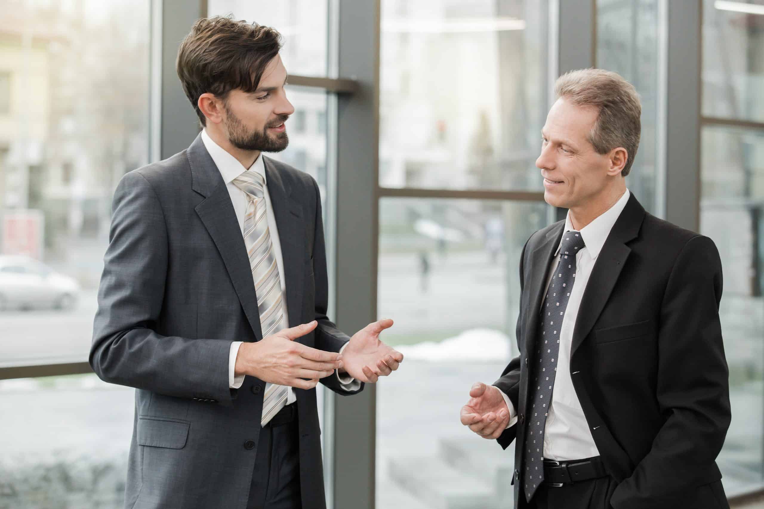 Stylish businessmen working in office